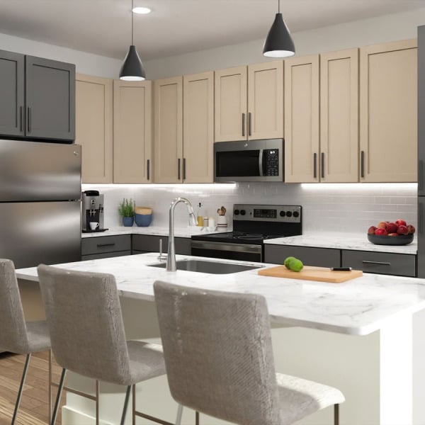 A modern kitchen with a white island and grey chairs.