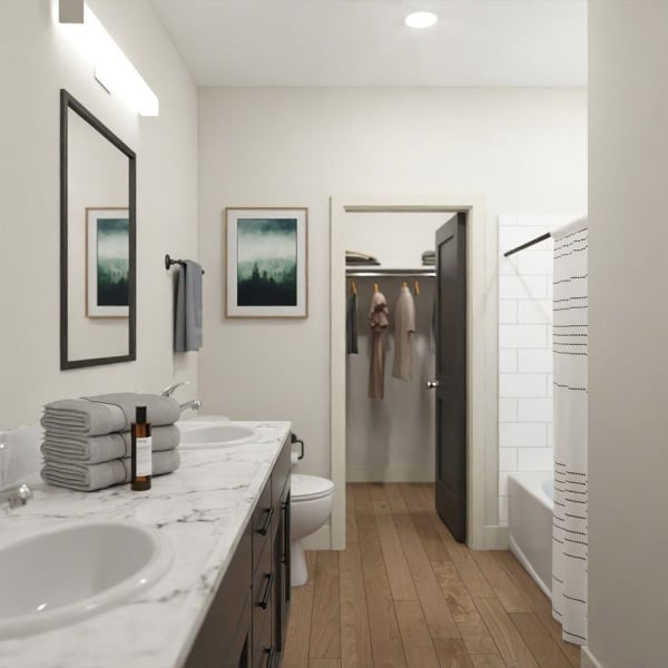 A bathroom with a white sink and towel rack.
