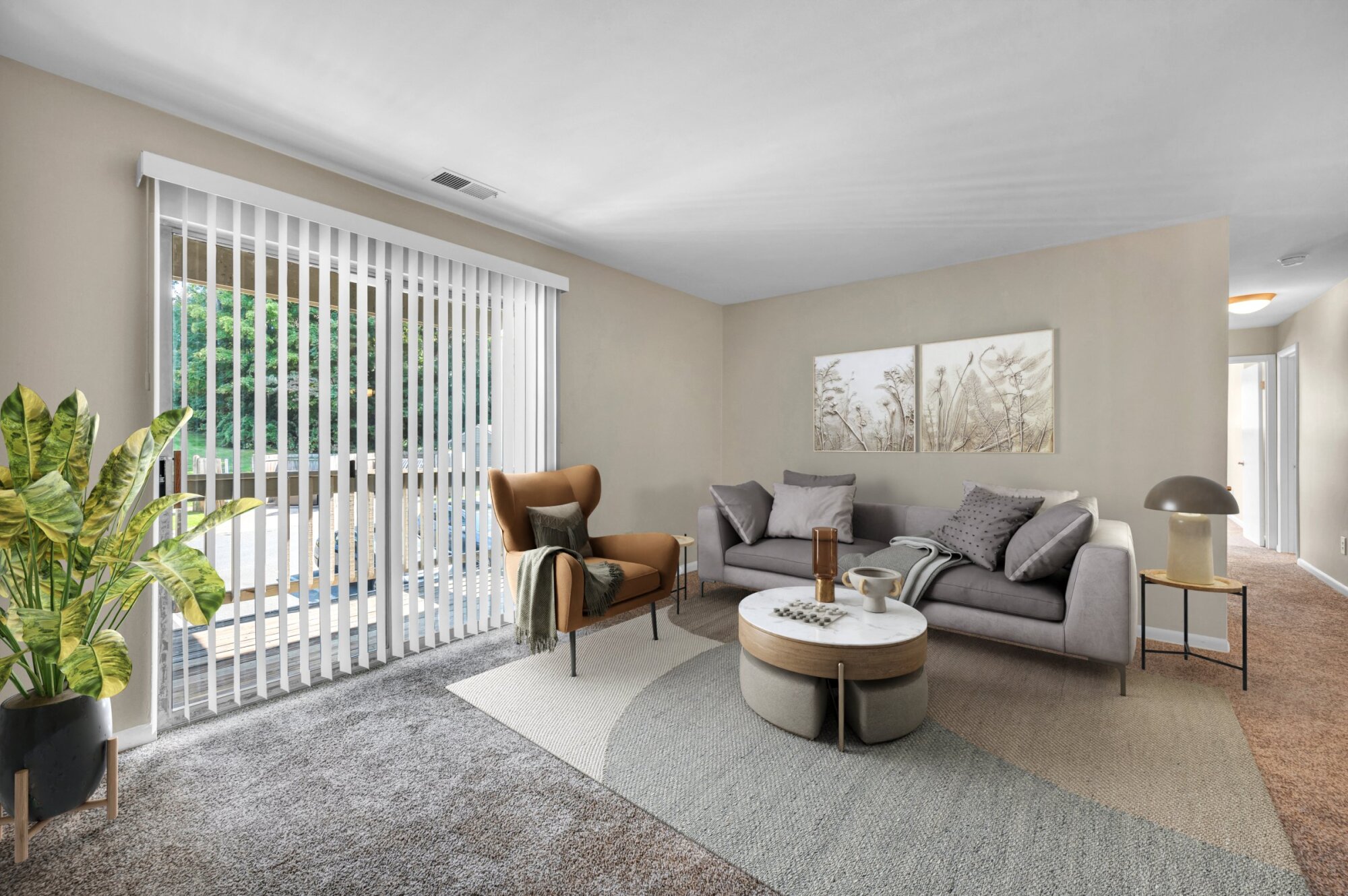 Milestone Apartments Outdoor patio with Adirondack chairs around a fire pit, surrounded by trees and apartment buildings.