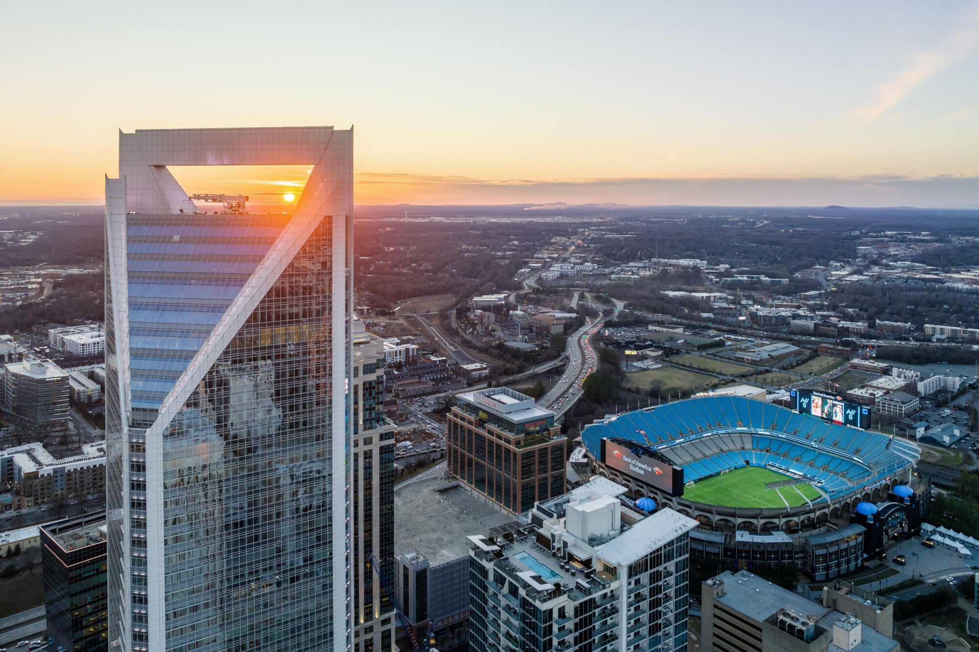 Uptown Charlotte, NC skyline at golden hour, a short drive from the Townes at University apartment community in University City.
