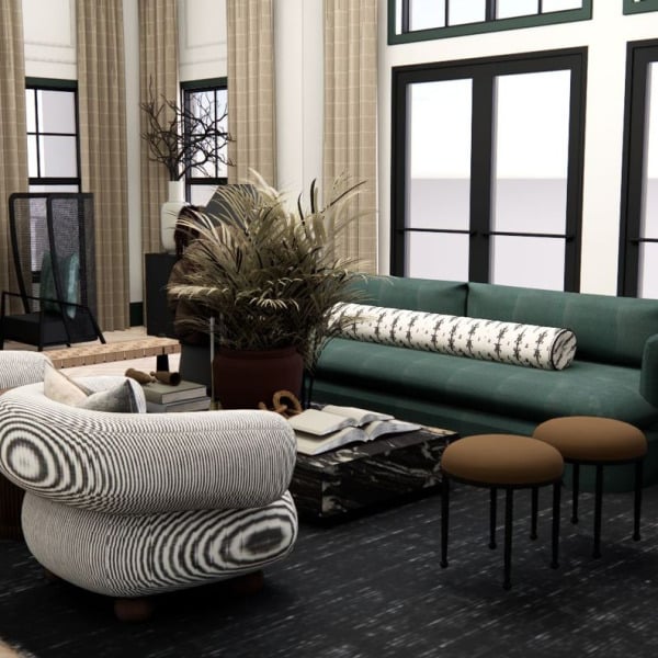 A living room with a green couch, a fireplace, and a large window overlooking the water.