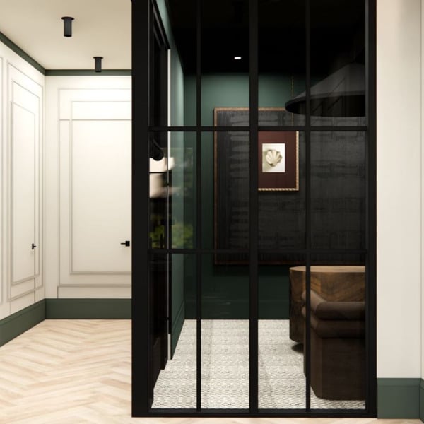 A hallway with white doors and a black gate.