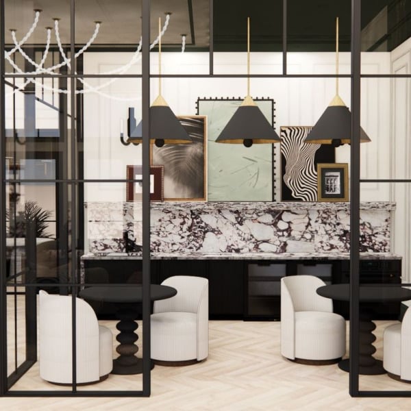 A modern living room with a black and white marble table and white stools.