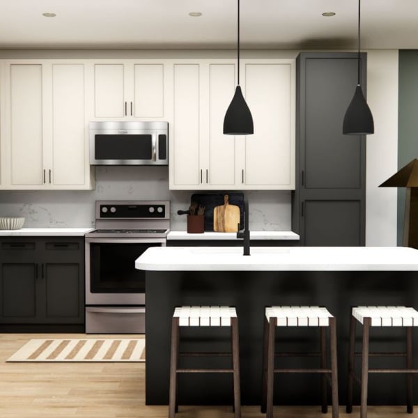 A modern kitchen with a white refrigerator and black countertops.