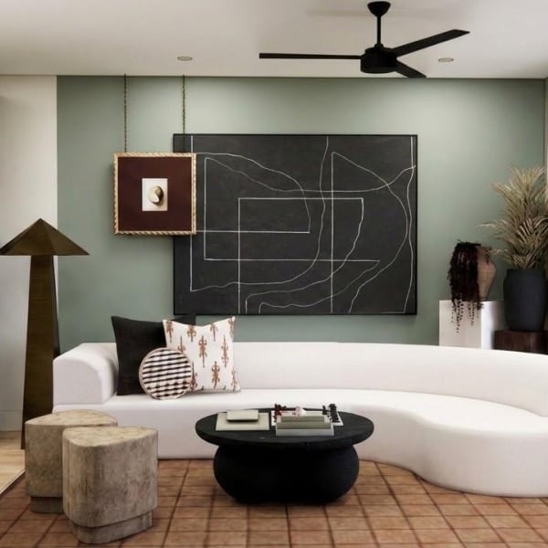 A modern living room with a white couch and a black coffee table.