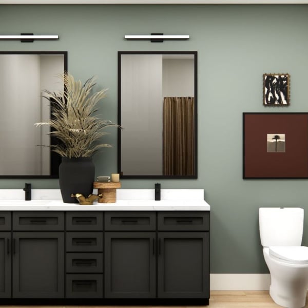 A bathroom with a green wall and a white toilet.