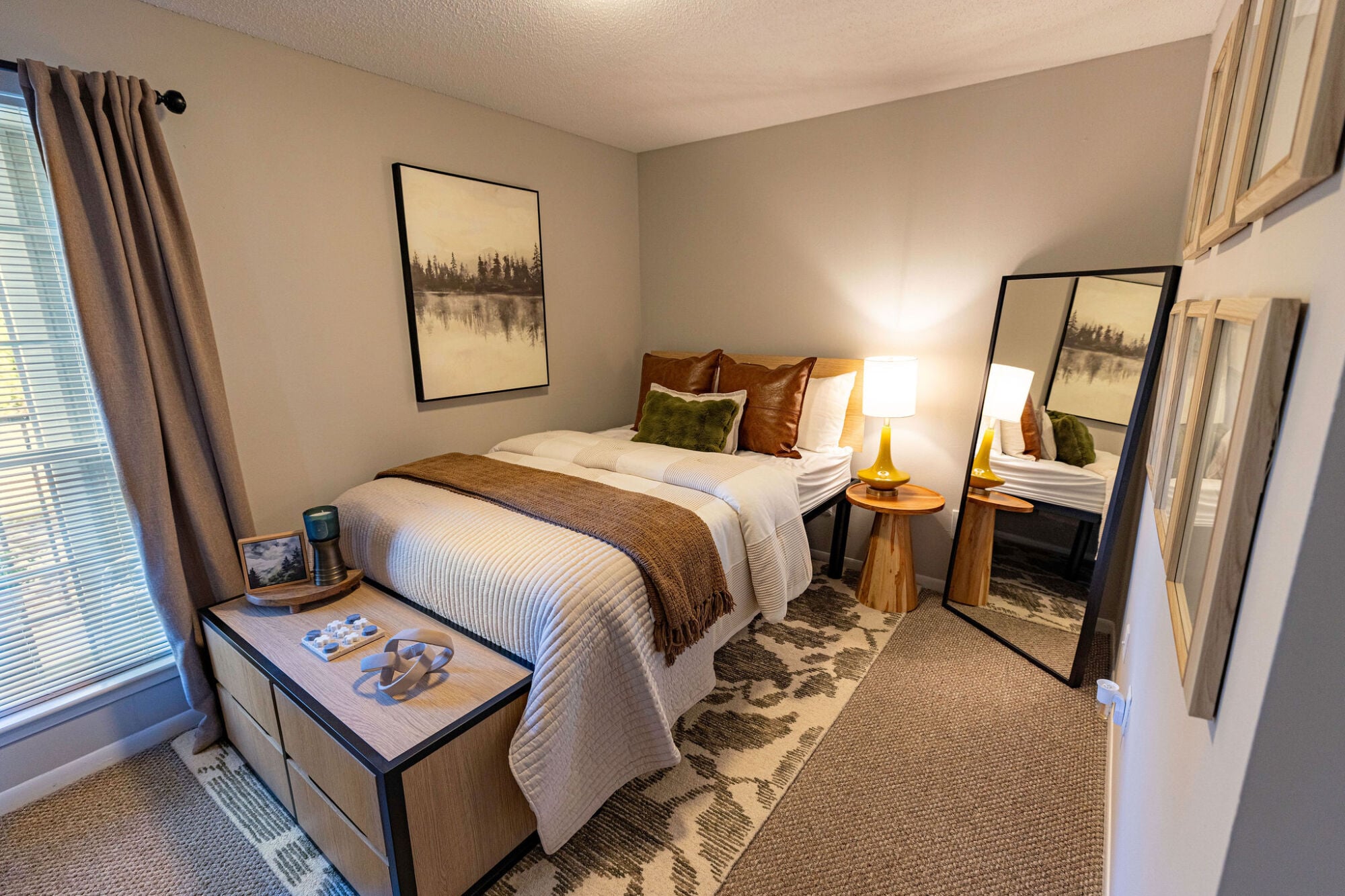 Furnished bedroom with queen bed and nightstand in a Knox Row student apartment in Knoxville, Tennessee.
