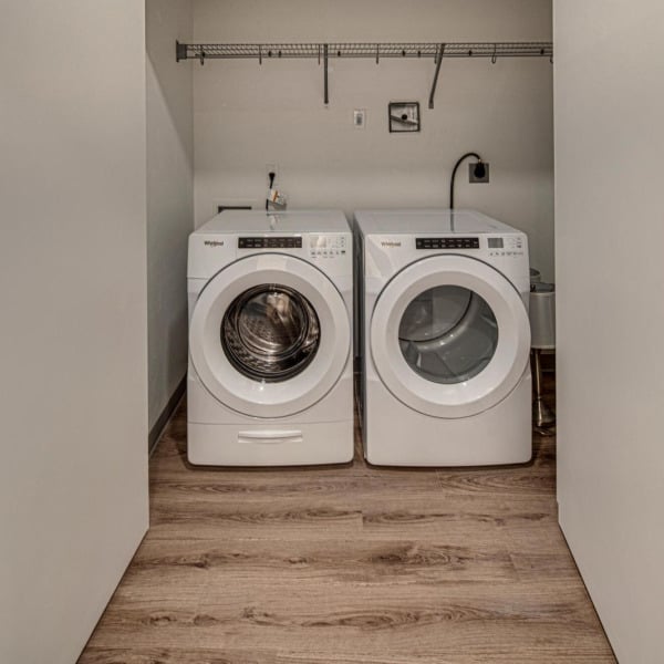 Side-by-side washer and dryer included in apartment homes at Cypress in Redmond, Oregon.
