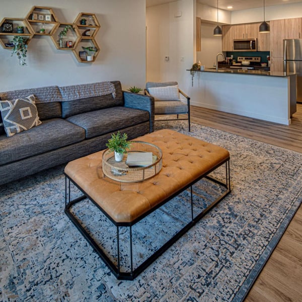 Model apartment showing the open plan from living room through to the kitchen at Cypress in Redmond, Oregon.