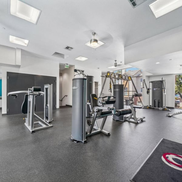 Weight machines in the 24-hour fitness center at Ontario Town Square Townhomes in Ontario, CA.