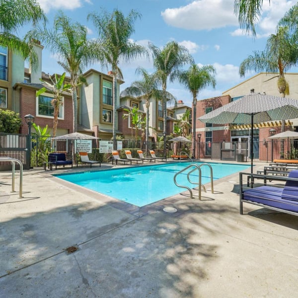 Poolside daybed lounger at Ontario Town Square Townhomes in Ontario, California, beside the resort-style swimming pool.