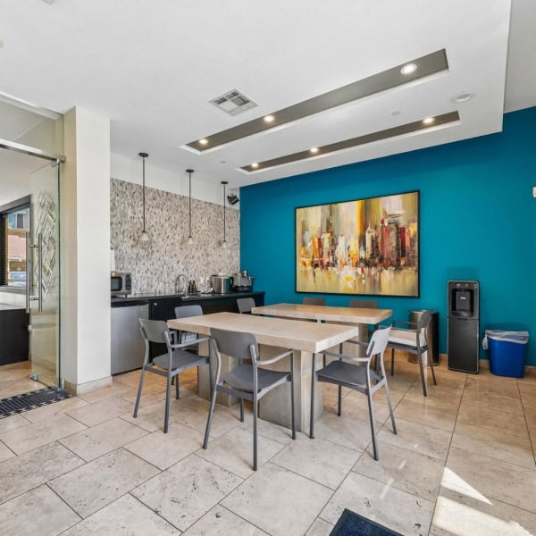 Community table in the Ontario Town Square Townhomes clubhouse in Ontario, CA, a shared workspace for residents to gather.