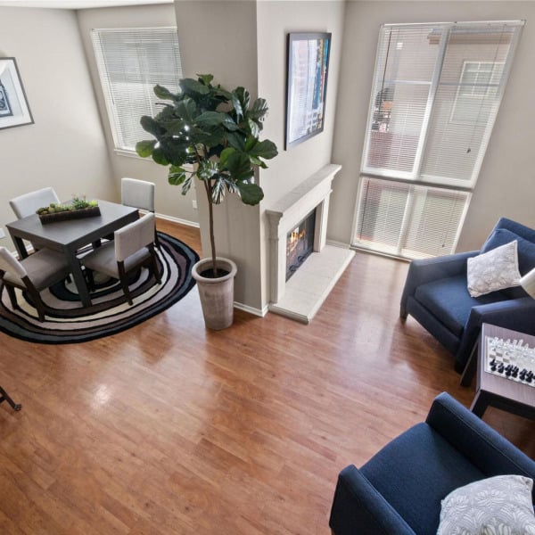 Living room fireplace and high ceilings in a townhome at Ontario Town Square Townhomes in Ontario, California.
