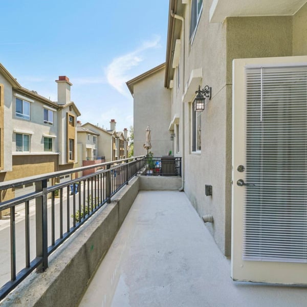 Private balcony overlooking the community at Ontario Town Square Townhomes in Ontario, CA.