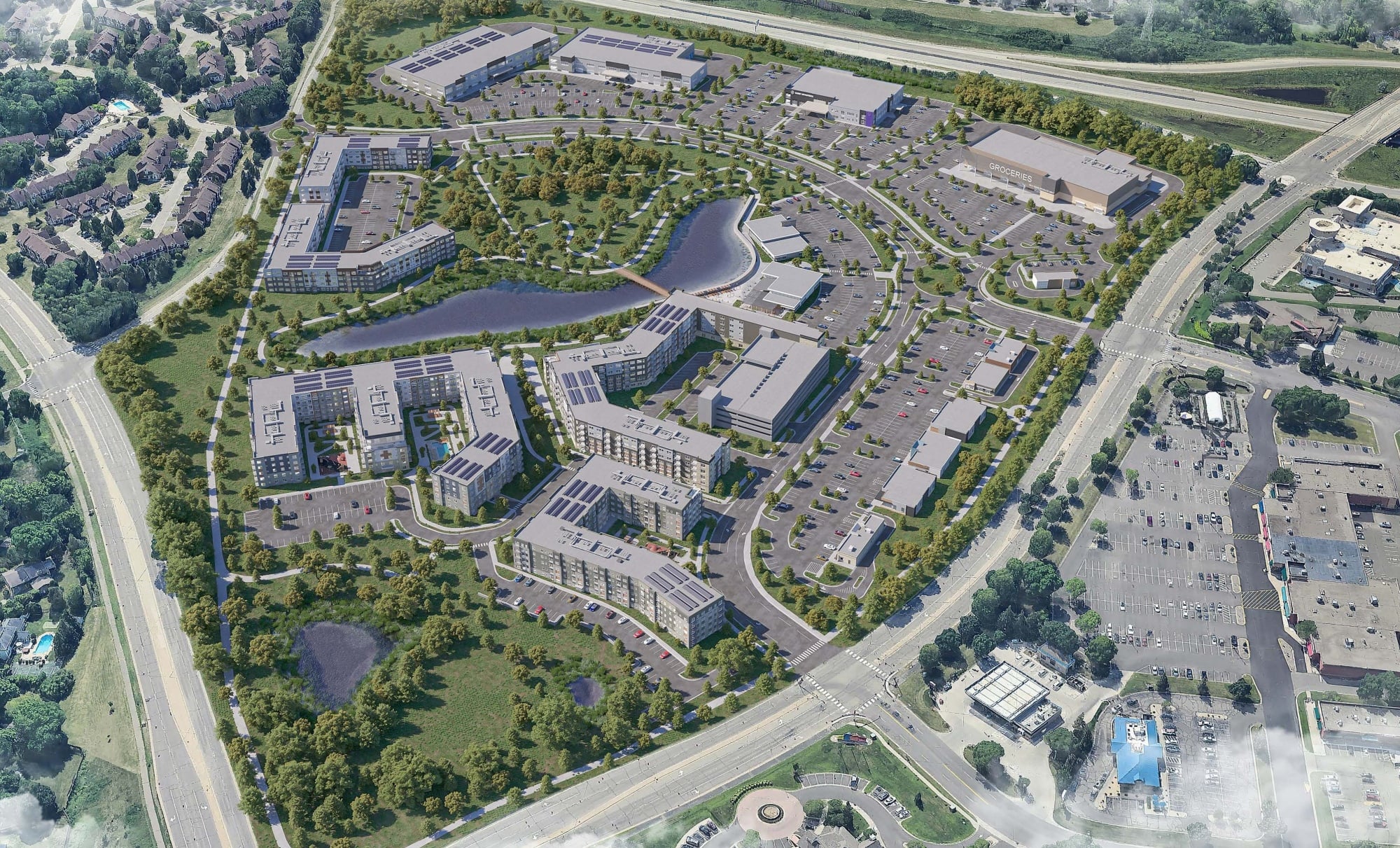 Aerial rendering of The Boulevard, a multi-use redevelopment in Plymouth, MN by Roers Companies and Scannell Properties, featuring apartment buildings, commercial spaces, landscaped green space, walking paths, ponds, and parking areas.