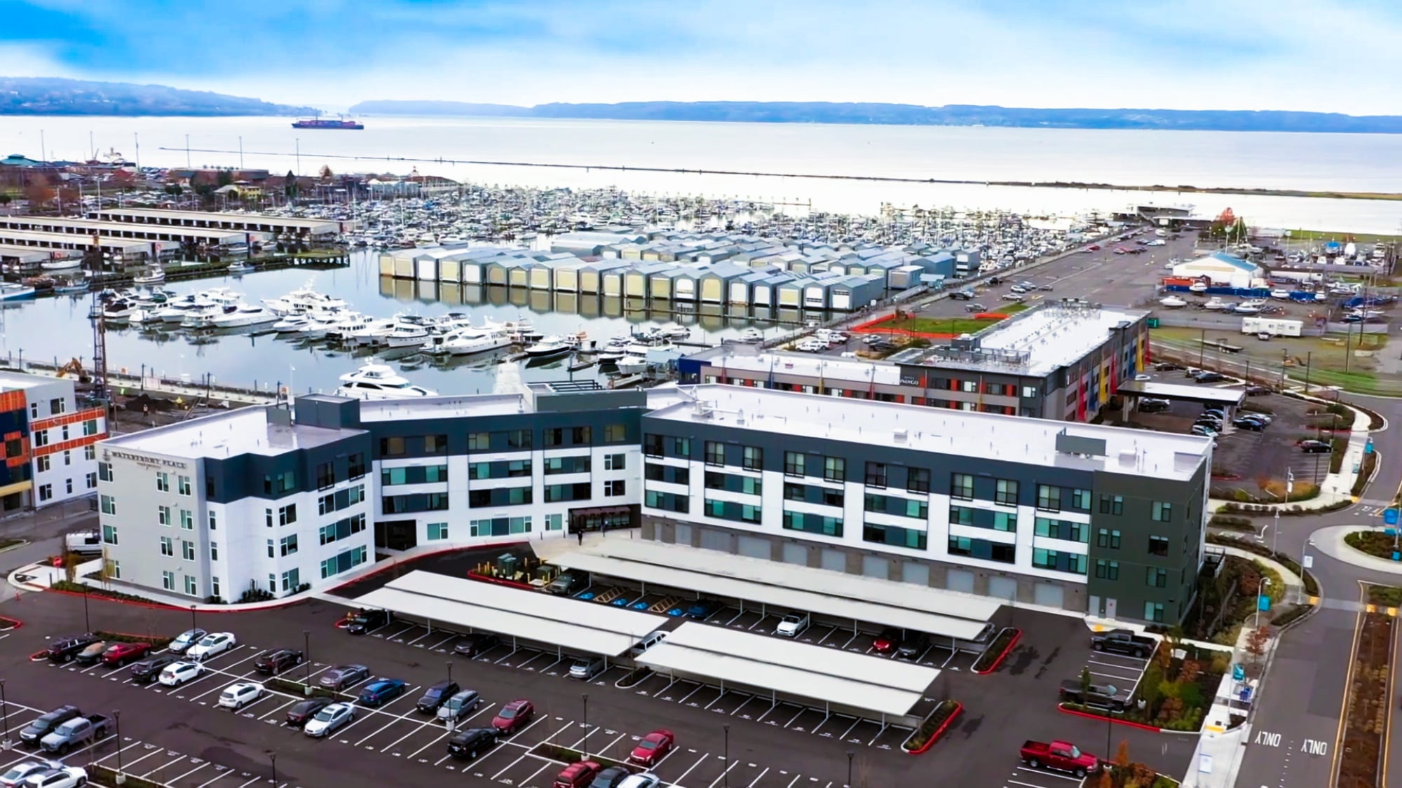 Aerial view of Waterfront Place apartments alongside the Everett marina in Everett, WA